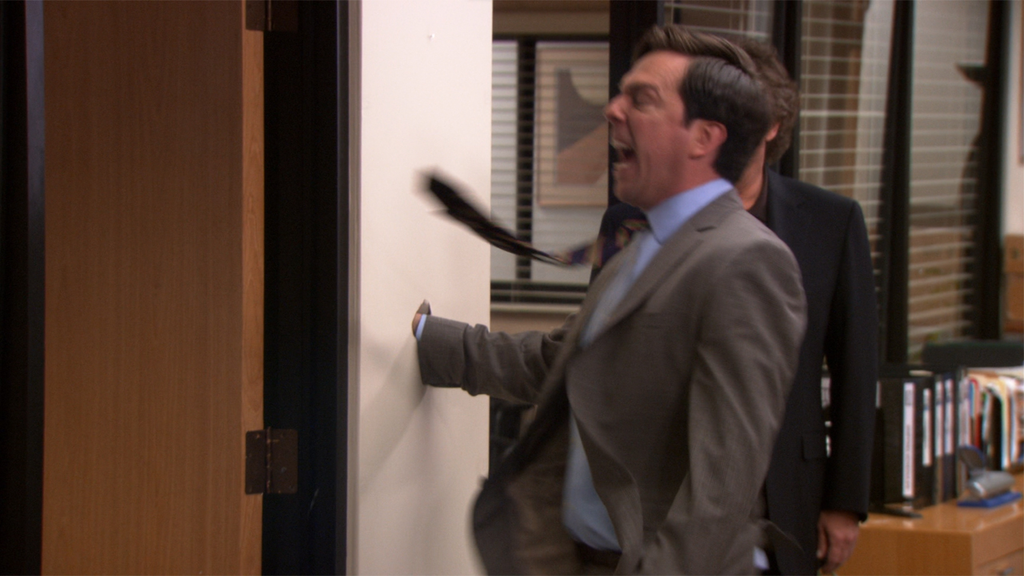 Picture of Andy from the office punching a wall out of rage.